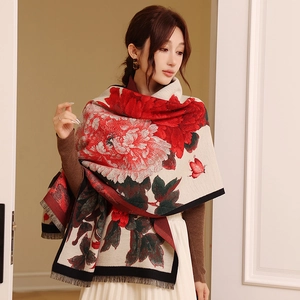 Elegant beige cashmere-feel scarf with red peony pattern and fringe details on model