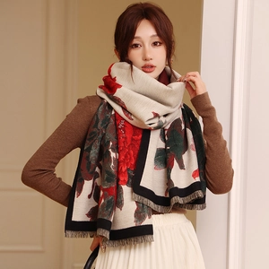 Detail of vintage floral scarf with red peony pattern and soft fringe edges