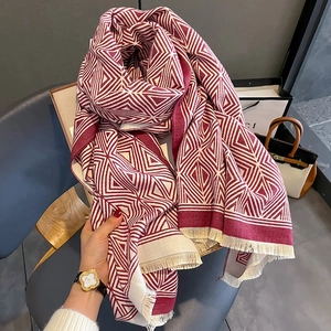 Deep red and cream geometric checkered scarf with elegant tassel fringe details