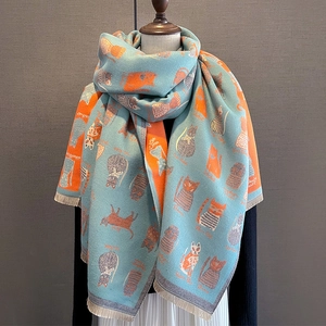 Winter faux cashmere scarf with blue and orange cat print and tassel fringe details