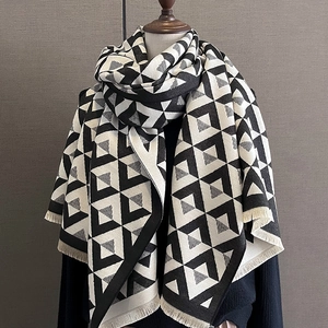 Women's black and white V-pattern cashmere-like scarf with fringe details for winter warmth