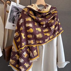 Thick warm cashmere-like scarf with cat patterns in dark red and yellow trim for winter
