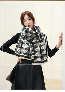 Winter outfit with soft faux cashmere scarf featuring black and white geometric shell patterns