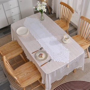 European white lace table runner with tassel fringe and elegant floral hollow pattern