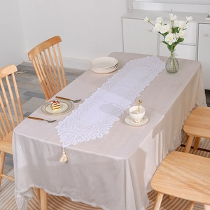 European style white lace table runner with floral hollow patterns and tassel details