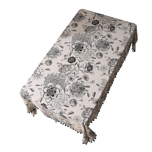 Nordic cotton linen tablecloth with black floral print and fringe pom-poms for dining table