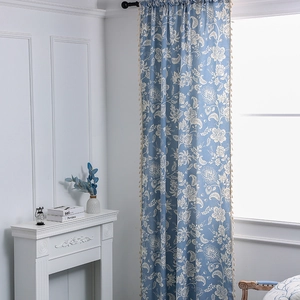 Light blue Nordic curtains with white floral patterns and elegant tassel fringe edges