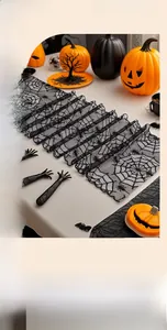 Detailed close-up of thickened black lace fireplace runner with intricate spider web patterns