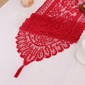 Elegant red lace table runner with hollow design and tassels for home dining decor
