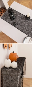 Detailed spider web and rose lace patterns on a black Halloween decorative table runner