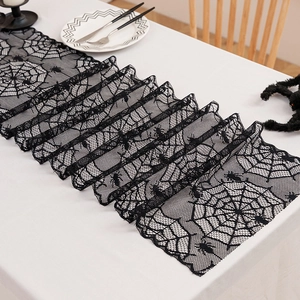 Halloween black lace table runner featuring a spider web pattern for spooky decor