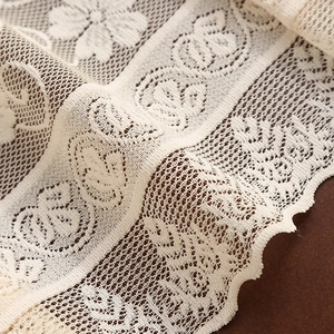 Retro hollow lace table runner with floral crochet patterns and scalloped edges