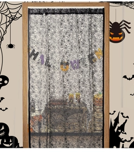 Detail of black lace spiderweb curtain with Halloween letter banner for party decor