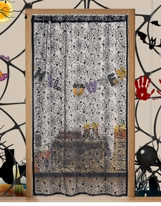 Detail of Halloween door curtain featuring black lace spider web patterns on wood door
