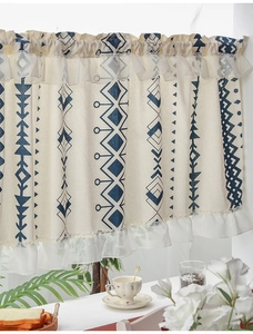 Detailed texture of bohemian pattern cafe curtain with delicate white organza ruffle edges