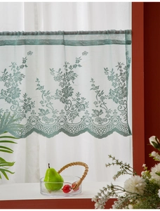 Detailed view of the green floral lace pattern on a fresh style cafe curtain decor.