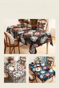 Detail of vintage flower and bird print tablecloth in black, white, and blue fabrics