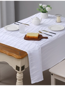 Close-up of white American jacquard tablecloth with waterproof vertical stripe texture