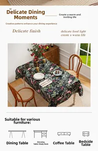 Detail of oil painting tablecloth with pink flamingo and tropical monstera leaf patterns