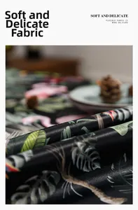 Detail of tropical floral tablecloth fabric showing soft texture and satin finish