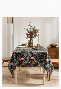 Detail of tropical rainforest tablecloth with flamingo and palm leaf patterns