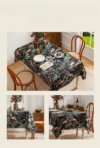 Close-up of vintage oil painting style tablecloth with flamingo and palm leaf patterns
