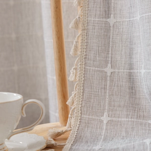 Modern linen boho curtain with white star embroidery and delicate tassel trim detail