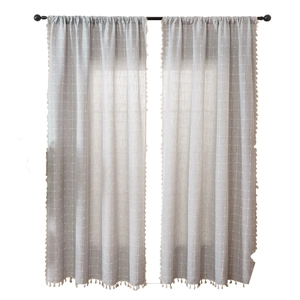 Grey linen curtains with vertical stripes and boho pompom fringe for living room