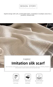 Detail of silk-like scarf showing breathable beige fabric with subtle gold shimmer texture