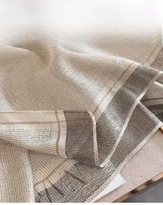 Close-up of lightweight faux silk scarf showing gold metallic mesh and grey gradient border