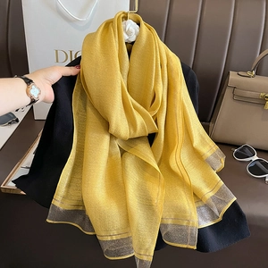 Elegant bright yellow silk-like scarf with wide silver-grey shiny trim for women
