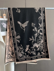 Detail of winter floral hummingbird scarf with elegant embroidery and white piping edges