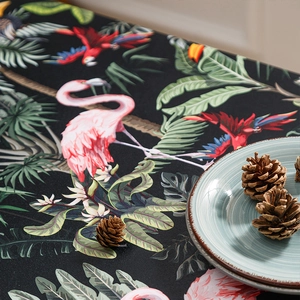 Tropical rainforest tablecloth featuring pink flamingos and exotic green leaves print