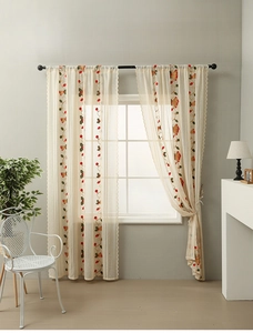 Close-up of Christmas bell embroidery on beige semi-sheer lace tulle curtains