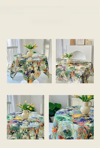 Detailed view of flowers and birds oil painting style tablecloth on dining table