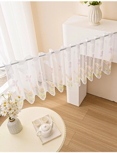 Close-up of white lace kitchen cafe curtain with colorful butterfly patterns and scalloped edges