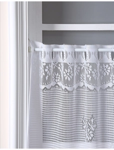 Detailed view of white lace cafe curtain with delicate floral crochet pattern and rod pocket