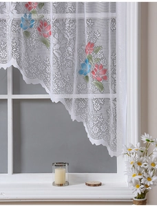 Close-up of white lace curtain featuring floral embroidery and wave edge design