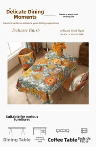Close-up of vintage floral cotton linen tablecloth with orange flowers and green leaves