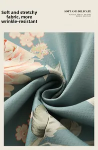 Detail of light blue floral cotton linen fabric with soft anti-wrinkle texture
