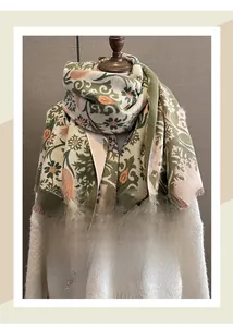 Close-up of bohemian floral cashmere-feel scarf with elegant tassels for winter warmth