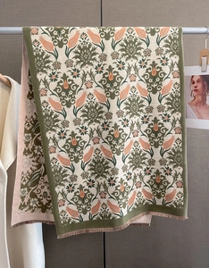 Detail of vintage floral jacquard scarf with fine tassels and damask patterns