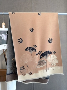 Detail of winter scarf with ginkgo leaf pattern and high-density fringe edges