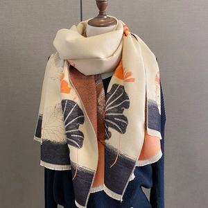 Detailed close-up of thickened jacquard ginkgo leaf pattern scarf with soft fringe