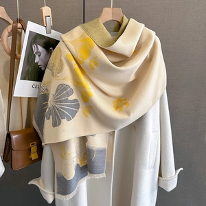 Winter scarf for women with ginkgo leaf print and tassel edges in cream and yellow