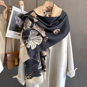 Detail of winter scarf with ginkgo leaf pattern and delicate short fringe edges