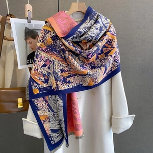Artistic geometric print cashmere feel scarf with soft fringes on white wool coat