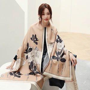 Detail of cashmere-like shawl with lotus ink print and delicate fringe edges