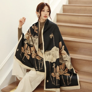 Detail of elegant black cashmere shawl with vintage lotus floral print and fringe edges
