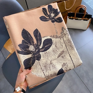 Detailed view of champagne gold floral shawl with elegant lotus pattern and soft texture